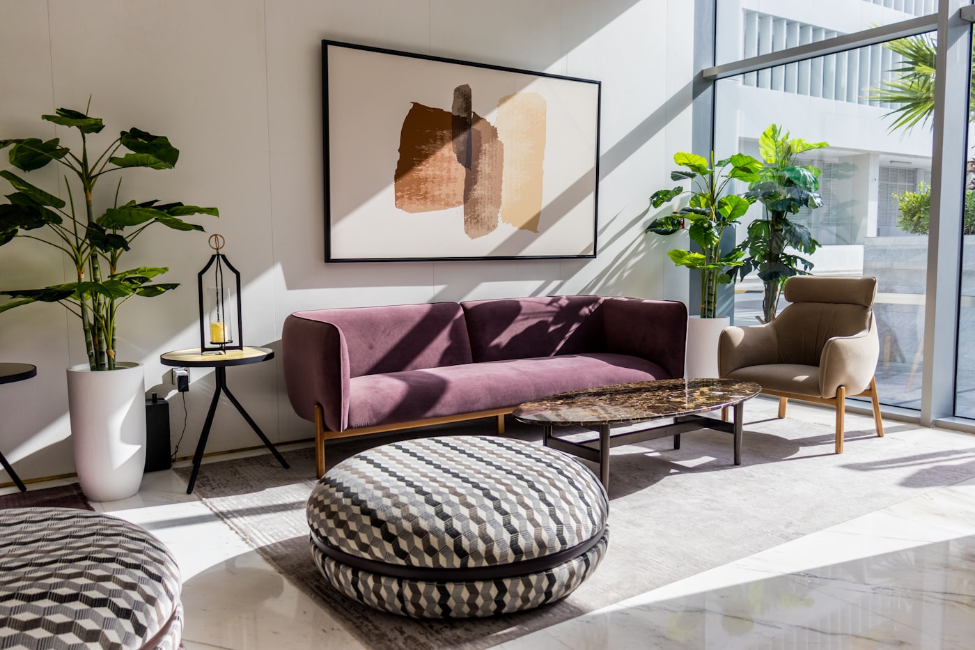 A living room with sofas and rugs
